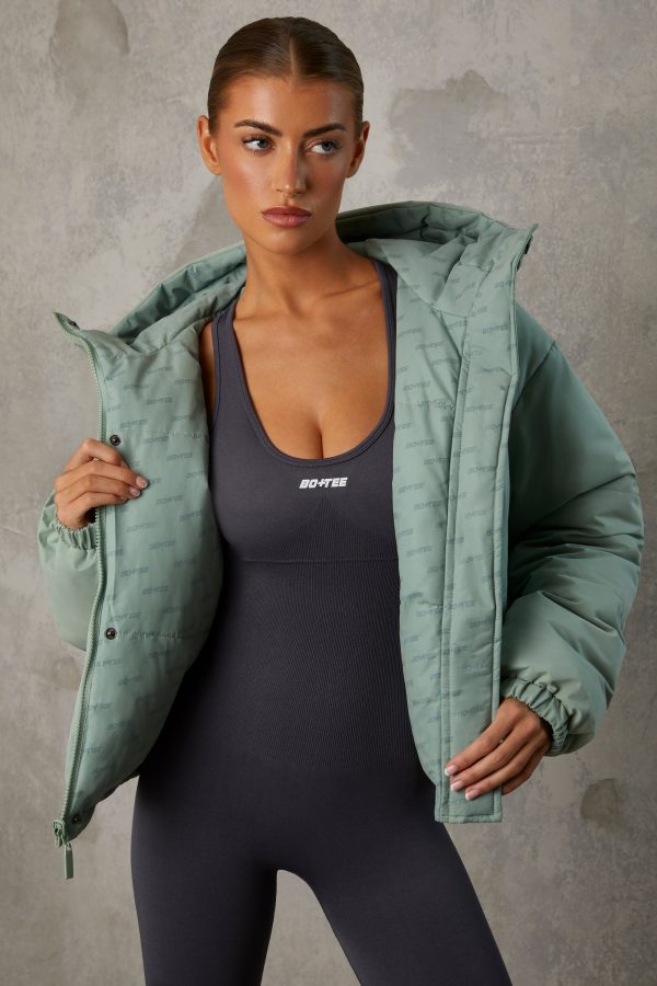 BT0789_15_Layer-Up-Iceberg-Green-Reversible-Puffer-Logo-Print-Coat.jpg