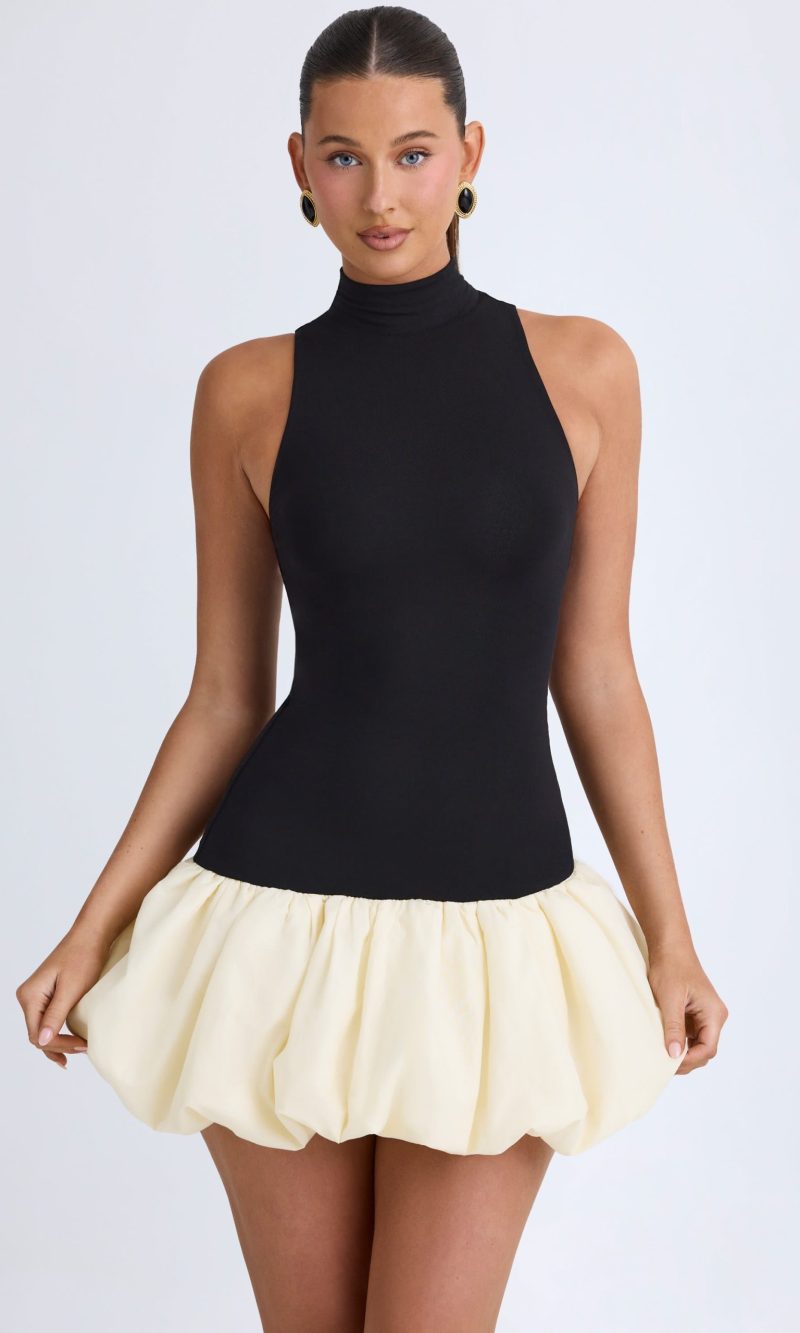Turtleneck Drop-Waist Bubble Hem Mini Dress in Black
