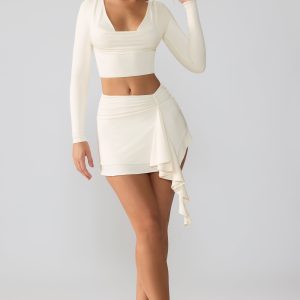 Slinky Jersey Mid Rise Ruffle Layer Mini Skirt in Ivory