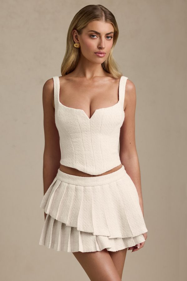 nada-layered-pleated-low-rise-mini-skirt-ivory_1_250416063351.jpg