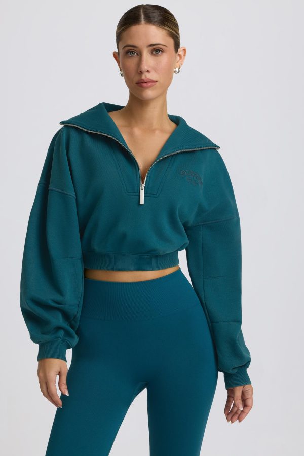 super-sculpt-comeback-season-quarter-zip-cropped-sweatshirt-teal_1_241231112544.jpg